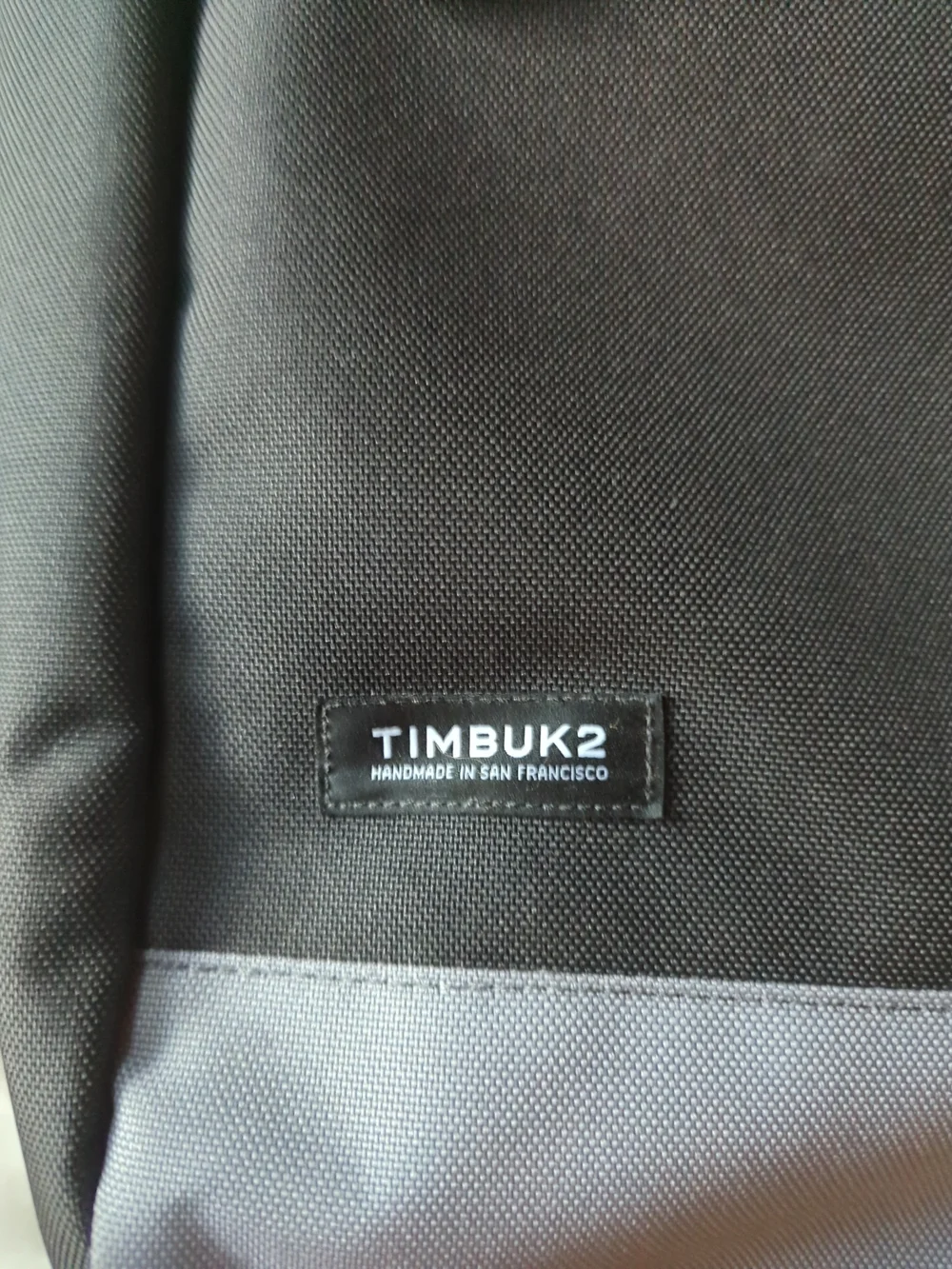 Timbuk2 Black Backpack with Orange Trim and Gray Base
